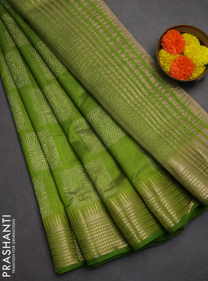 Semi raw silk saree light green with allover box type butta prints and zari woven border