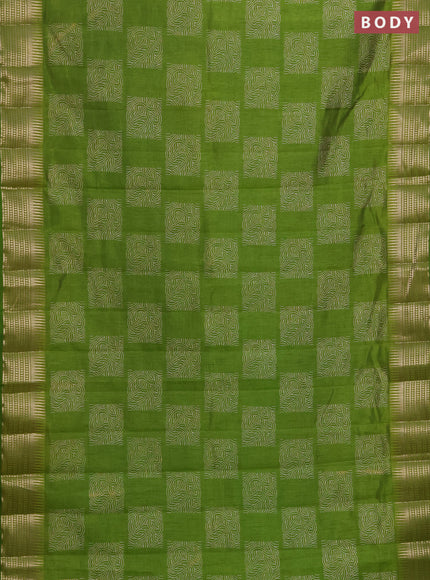 Semi raw silk saree light green with allover box type butta prints and zari woven border