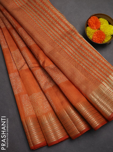 Semi raw silk saree rust shade with allover box type butta prints and zari woven border