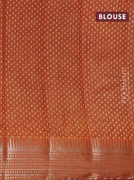 Semi raw silk saree rust shade with allover box type butta prints and zari woven border