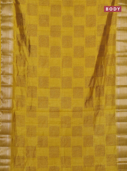 Semi raw silk saree yellow with allover box type butta prints and zari woven border