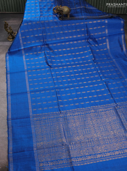 Pure dupion silk saree cs blue with allover zari woven floral butta weaves and rettapet zari woven border