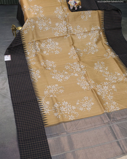 Pure tussar silk saree sandal and black with floral digital prints and temple design zari checked border