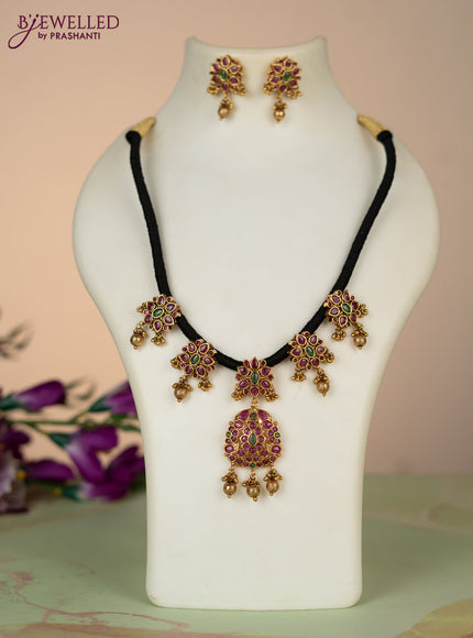 Black thread necklace with kemp stones and golden beads hangings