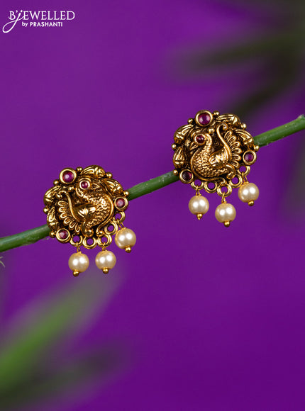Antique earrings peacock design with ruby stones and pearl hangings
