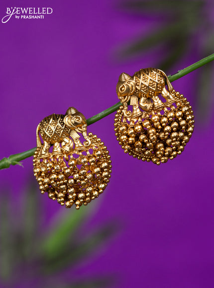 Antique earrings with elephant design and golden beads hangings