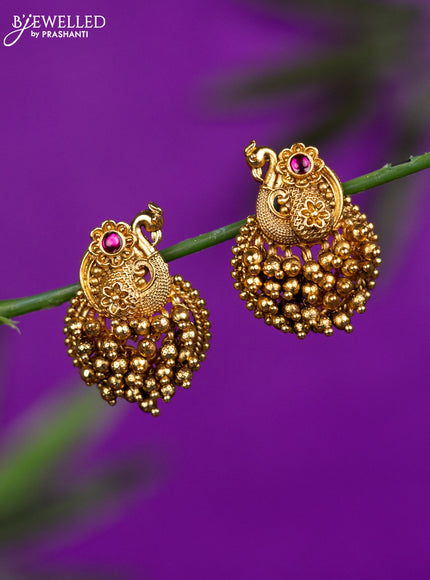 Antique earrings peacock design with ruby stone and golden beads hangings