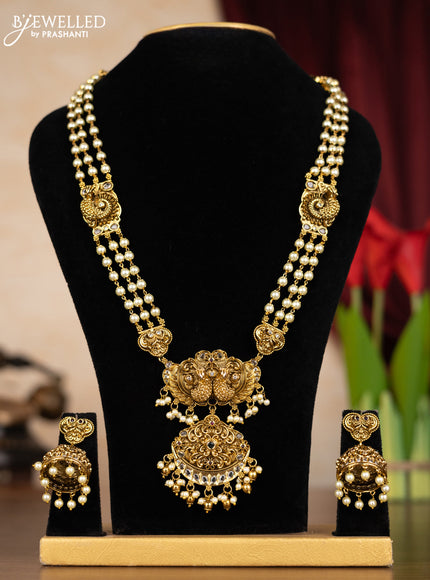 Pearl haaram peacock design with kemp & kundan stones and pearl & golden beads hangings