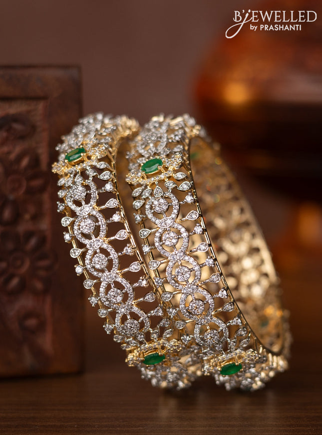 Zircon bangles with emerald and cz stones in gold finish