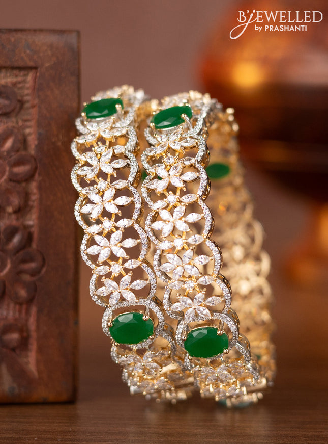 Zircon bangles with emerald and cz stones in gold finish
