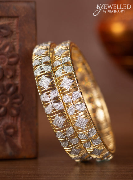 Zircon bangles with cz stones in gold finish