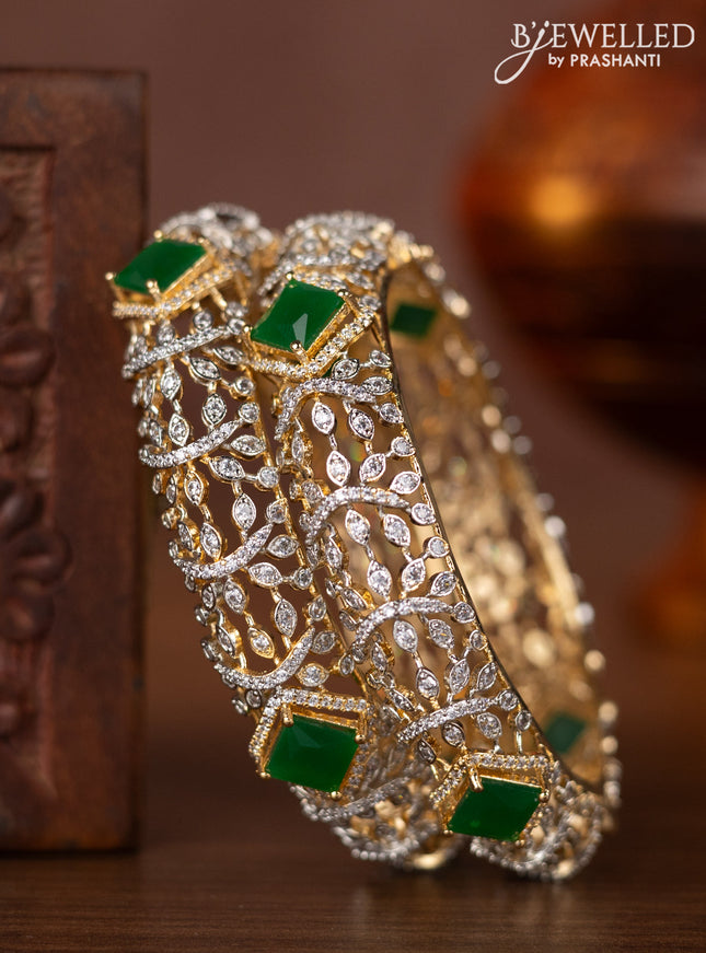 Zircon bangles with emerald and cz stones in gold finish