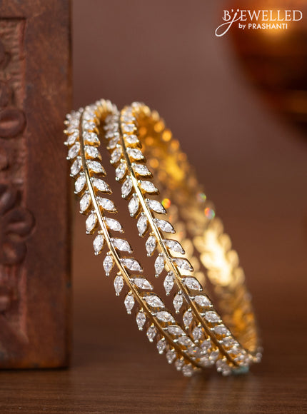 Zircon bangles with cz stones in gold finish