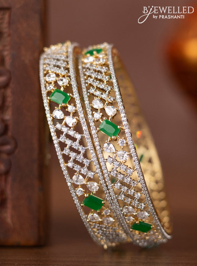 Zircon bangles with emerald and cz stones in gold finish