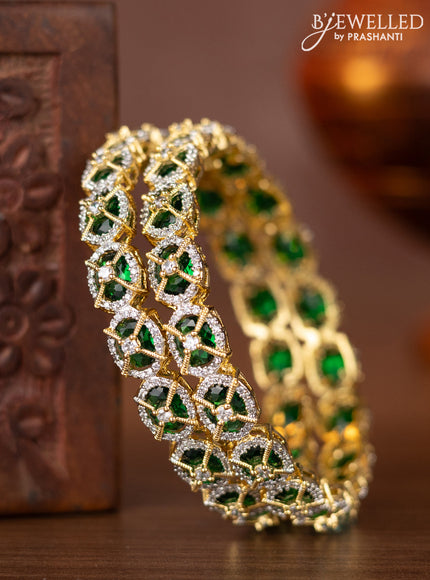 Zircon bangles with emerald and cz stones in gold finish