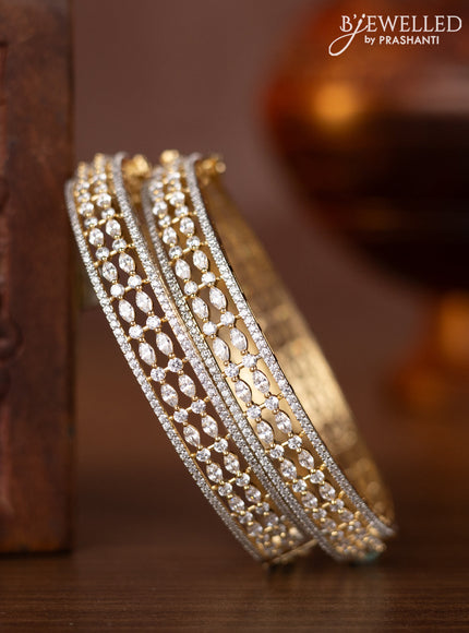 Zircon bangles with cz stones in gold finish