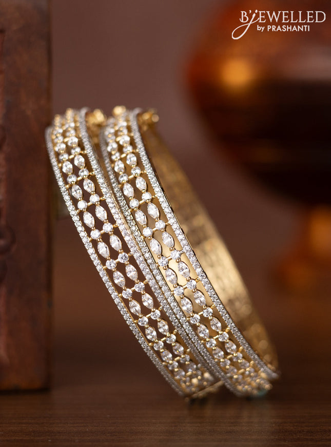Zircon bangles with cz stones in gold finish