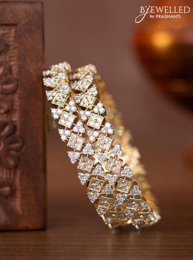 Zircon bangles with cz stones in gold finish