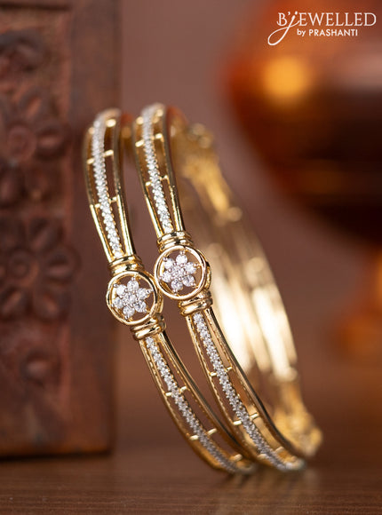 Zircon bangles with cz stones in gold finish