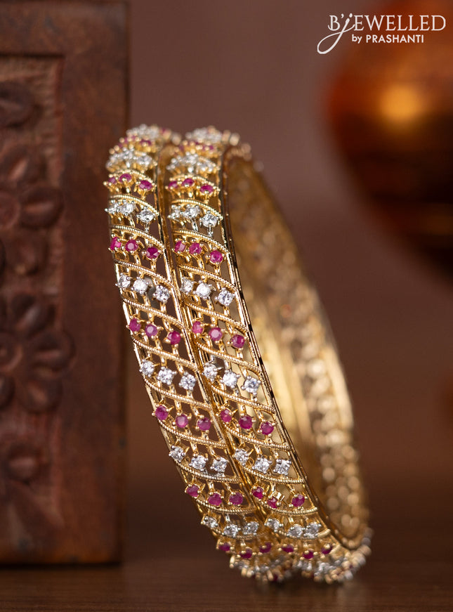 Zircon bangles with ruby and cz stones in gold finish