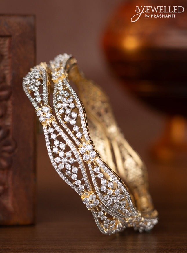Zircon bangles with cz stones in gold finish