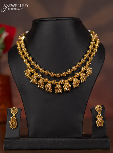 Antique double layer necklace with ruby stones and golden beads hangings
