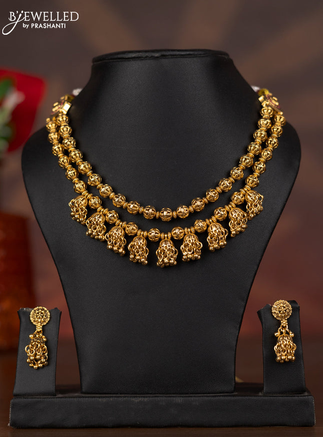Antique double layer necklace with ruby stones and golden beads hangings