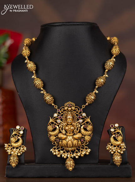 Antique necklace lakshmi pendant with ruby & kundan stones and pearl & golden beads hangings