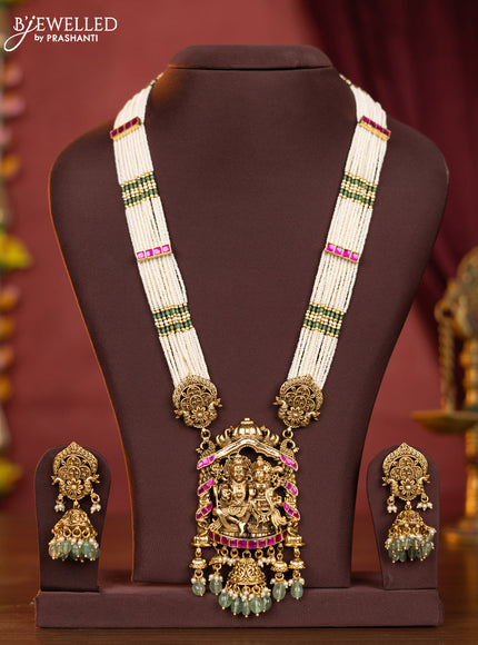Pearl haaram shivan parvathi pendant with pink jadau stones and mint green beads hangings