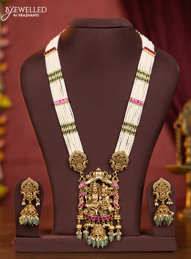 Pearl haaram shivan parvathi pendant with pink jadau stones and mint green beads hangings