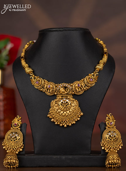 Antique necklace with elephant & peacock design with ruby & kundan stones and golden beads hangings
