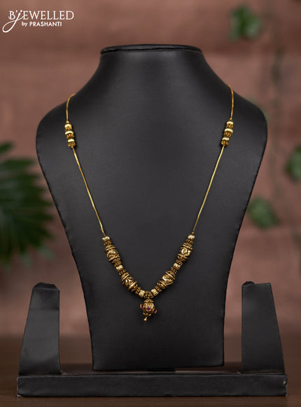 Antique chain with simple design and ruby stone