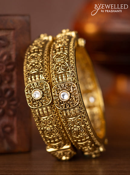 Antique screw type bangles with kundan stones