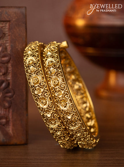 Antique screw type bangles with floral design
