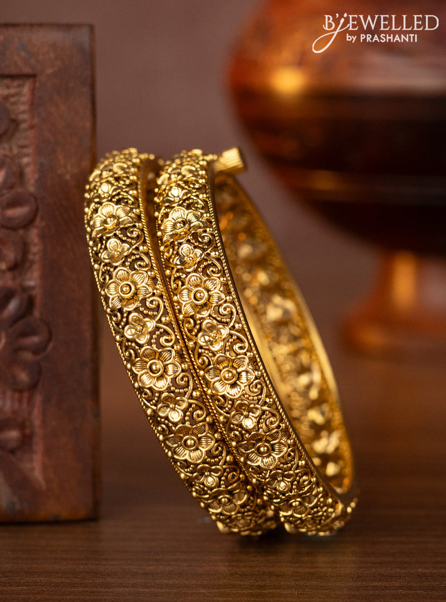 Antique screw type bangles with floral design