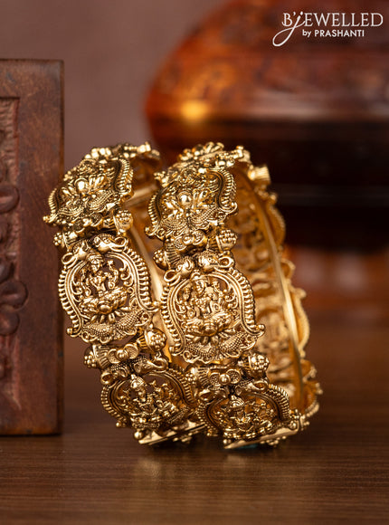 Antique screw type bangles with lakshmi design