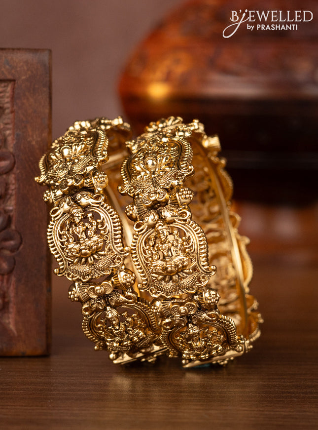Antique screw type bangles with lakshmi design