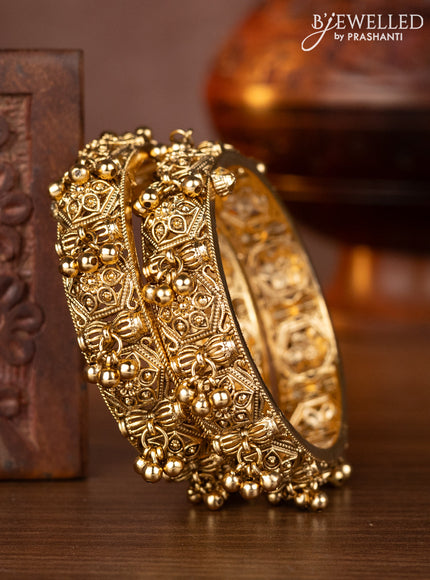Antique screw type bangles with golden beads hangings