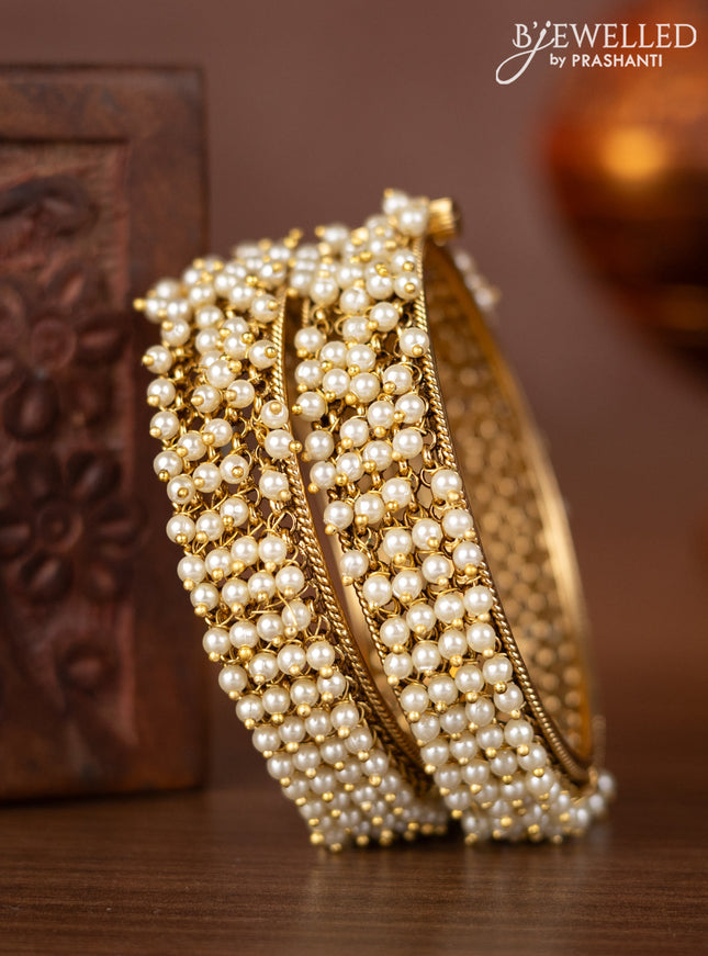 Antique screw type bangles with pearl hangings